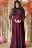 I wore this dress for my baby shower.. I Bought a small size it looked perfect.. Though have to do little bit adjustments due to increased bump but otherwise all good.. Highly recommend - Shubhi S.