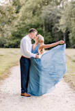 wore this dress for my engagement pictures! ABSOLUTELY LOVED IT! It does cut down super low in the front as well as the sides. I hid the strings that tie in the dress because I like it better without it. I normally am a small and got the XS in the dress. - Haley C.