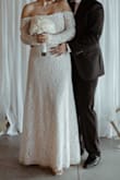 I purchased this dress as a last minute option for my civil wedding. It fit a bit loose at the top and sleeves but I made it work. If I had sized down I don't think it would have fit my waist or been low enough on the bottom. - Jessica M.
