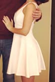 I wore this to my bridal shower and LOVED it! It shows more skin than I normally would, but I felt gorgeous in it. It fit great and I never felt like I was falling out of it. - Ashley E.