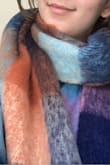 The scarf is very high quality and cozy. Colors look different than on the model, though I'm still very happy! - Natalia Z.