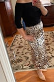 I love this skirt. It's so flowy. I originally ordered a medium and it fit but was a little too tight on my tummy. The large fit perfect for my body type. It can be dressed up or down. Worn with heels or flats. The pattern is so pretty and the spots are a blueish hue. My whole wardrobe from head to toe is Lulus! - Dana S.
