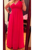 When I received the dress, I thought it was a stunning red color and the material was much more durable and heavy then I anticipated it to be. There are 3 layers to dress in the length part. I ended up having the top altered to have it closed up a little more. The tailor did say this dress was difficult to alter, but was able to and it looked perfect when it was done. I did not take it to a dry cleaner. I was able to just use my home iron on low to remove the wrinkles. I have received many compliments on this dress and am SO glad I got it! - Randi D.