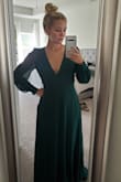 I bought this for a Christmas party so I haven't worn it yet but I've tried it on a couple times and I fall in love every time I do!  I did have to get it altered because I'm 5'1 and even with 4 inch heels, I still had to get about 4-5 inches taken off! It's super long, but totally worth it! - Sydney S.