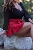 This top shows a perfect amount of cleavage while still looking classy. Pictures don't do it justice. I only think marked it as a bit small because it seems a bit short and kinda tight to snap at the crotch, but I wouldn't size up. Goes great with skirts and jeans. - Rachel J.