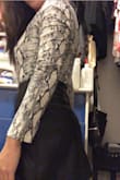 The cut and fit of this bodysuit is very bold and sexy. You can match it with a black leather mini skirt or some nice fitting black jeans. 
The material is quite stretchy so if you think you're in between sizes, you can either size down for a more fitted look or go a size up if you'd rather it be a little more loose. It'll look good either way. - Nancy C.