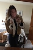 I ordered a size L because I would rather the jacket fit loose than tight. My boyfriend's mother opened the box and tried the jacket on. She fell in awe with it, but she needed a smaller size. I order her two sizes a small and a medium. When the package arrived, I was excited to try the M. The small fit her perfectly and wouldn't you know the Medium fit me too! Haha. When all is said and done I decided to keep the L, just because if I choose to wear chunky knit sweaters or a heavy sweatshirt- the jacket won't be too bulky. Keep that in mind. This trucker jacket is a showstopper! - Emma B.