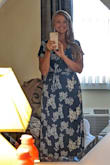 I needed a dress option for a semi-formal wedding at a ritzy location out-of-state. I was CLUELESS what to get but this pretty blue number kept calling my name. I ordered a large and a medium and if I could have mish-mashed the two together to fit my 'smaller on top, larger on bottom' shape that would've been the cat's meow! 

However, I went with the medium and was very happy with the choice. I did use double-sided fabric tape to hold the bust area a little closer to home. 

One word of caution: if you'll be outdoors in a windy environment, plan on the dress blowing open as much as is shown in the picture. Luckily I had the forethought to wear a long enough tank beneath to help keep the hidden parts hidden. - Keri P.