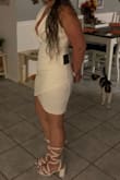 So I bought this for a NYE wedding. I LIKE the dress. I would LOVE to wear it to a club, im just not sure it'll make the cut for a wedding LOL. Its made of a nice thick material and very comfortable. The bust is VERY low cut. If I end up wearing it I will have to put a stitch in to make me feel more comfortable. I'm 5'3 and 140(ish) lbs. I got a Medium. It fits well BUT I think its meant to fit very tigh, but I am curvy... So if your not comfortable with that dont get this dress. It hides my belly enough and doesn't seem to make me look "bigger"  so thats a plus. over all its a decent price and a cute dress to have in the reserves even if I dont wear it to the wedding. - Kim M.