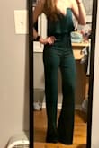A friend of mine wore this to a wedding in blue and I LOVED IT!! I had to have it and ordered in the green. It fit great when I got it and I still love it but it does run pretty long!!! I'm 5'6" and with 3-4in heels on the pants still touch the floor. So I would not suggest for someone on the shorter end or if not wanting to wear heels unless you're willing to hem it.
Also the color is more of a dark forest green than how it looks online. But still a great color! - Ellen B.