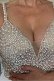 The dress is gorgeous but unfortunately wouldn't work for my wedding as I'm an older bride and it is a little more revealing than I'd like for my daytime family wedding (hubs-to-be loved it though!).  As has been noted it's very long, even for a tall person but otherwise it fit beautifully and the beadwork was stunning.  In terms of the purchase process, it arrived quickly and the return is in progress but has so far been extremely easy.  If you're considering buying a dress online, I'd highly recommend Lulus. - Mary R.