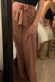 Wow I am so happy I bought these! I bought both Mauve & Black colors and CAN'T wait to wear them! They look so chic and classy. I have long legs and the slit does not come up too high BUT they are long pants so must be worn with heels. It is a bit harder to see the top details on the black but still are perfect for a night out. Will add pictures when I finally have an excuse to wear them out this summer!

Update: I wore the mauve one recently and I love it. The bow looks so perfect and the color is gorgeous! - Rebecca S.