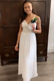 This dress is amazing, it fit perfectly around the bust and waist. I had to get it hemmed a little bit, but other than that, it was great! - Tala R.