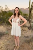 I love this dress!  I wore it for my senior homecoming and it was perfect! The fabric does wrinkle easily, but other than that it fit great and the flower detailing is super cute! - Holli W.