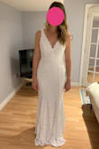 I purchased this and another dress from Lulus (Romance Dreamer). I plan on choosing one of them to be my wedding dress, but I'm having an extremely hard time deciding because they are both so pretty in different ways. This dress feels heavy and seems like it should be more expensive than it is. The quality is excellent. The mermaid cut and v-neck/back is extremely flattering. I compared my measurements against those in the sizing chart and made my size selection based on that. The dress ended up fitting perfectly. I highly recommend this dress - Meaghan G.