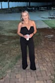 I was skeptical about wearing this just because I've never really worn a jumpsuit/romper. I'm big breast & small waist so it's hard to find one-pieces that fit good. After reading reviews, I took a chance and ordered a small. It fit perfectly! Not too small on my boobs and not loose or big in the waist/hip area. It does run long but that was an easy fix. Wore it to a wedding & I got so many compliments in-person & on Facebook! - Elsi P.