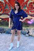 I purchased this dress for my friends Vegas wedding. I ordered a medium based on the other reviews and I think this is very true to size. It's a very comfortable dress to wear, and soooo flattering. We were moving around all day and I felt good. It is a (little) short in the front where the fabric crosses, but not uncomfortably short. The sequins weren't scratchy like other materials can be. I wore a regular bra and felt great! If you're on the fence, this is the dress!! - Krista H.