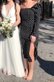 Wore this for a late fall wedding and it was a hit. The style felt out of my comfort zone initially but it ended up perfect when dressed up with heels and jewelry. There is no stretch at all and I have a small bust and still felt a tiny but constricted up top, so maybe caution to those with bigger upper halves. - Rachel B.