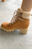 Ok, I never write reviews but I had to write one on these boots because they are so amazing. The perfect fall staple and the perfect shade of brown. I've never owned a pair of boots like this so I was afraid they'd feel clunky but they don't! They are super warm; fully lined and so comfortable. The shoelaces tie around the leg so you can tie them as loose or tight as you want. I ordered a size 7 which is my normal size and they are maybe a tiny bit big but with thicker socks they'll be fine! Wouldn't size up. A little pricey but so worth it! - Daniella D.