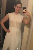 This dress has a lovely pink underlay, but I think it needs a side slit or a low back since the front is coming up so high. It was too loose on me; I would have ordered a small if I chose this dress. Also cap sleeves don't do my arms any favors. - Jessica P.