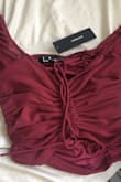 I bought the burgundy and WOW... completely different color than the photos!! The photos show a deep dark red, almost like a rusty/brick red. The actual shirt is just a very boring burgundy. Very disappointed. - Caitlin C.