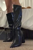 I usually wear a 7.5/8 and got a 7.5 and they fit just right! The top is loose on my calf but I expected that and wanted that look. They're pretty comfy too! - Megan D.