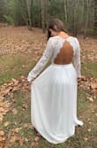 I got so many compliments on this dress. The back is the ultimate draw but overall it fit like a glove. I normally wear a small in most dresses but I wear an XS on this site. Everything fit perfectly! I didn't wear heels so it was a little long but it was good for the small ceremony. - Michaela F.