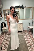 I ordered this dress for our marriage ceremony, and I could not be happier with the fit, feel, look and overall value! The dress is lined, the material has some stretch so it's comfortable and flattering, and I received so many compliments. It looks sleek and nobody believed that it was ordered online for the price I paid. The fit was perfect and needed no alterations. I wore 2.5-3 inch heels for length reference. I absolutely love this dress and want it in other colours! - Melissa L.