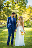 This is a truly gorgeous gown, the beadwork is stunning and really makes this dress feel special. Originally we had a destination wedding planned, but due to COVID we had to cancel and instead did a Zoom wedding at the courthouse, and this dress looked beautiful in pictures and on video!!
The skirt is very heavy, so if you live somewhere hot & humid, your legs will absolutely be hot as an oven but it was worth it to me! The back of this dress is gorgeous too, though it was a little loose/baggy.
I purchased a size 6 & it fit my 29" waist perfectly. It's free through the hip so it was actually really comfortable. It is super long-- I am 5'7 and was wearing 3.5 inch heels and the skirt still was dragging on the ground just slightly. If you get it altered though, that's an easy fix. For the price, I HIGHLY recommend this dress! - Johanna K.