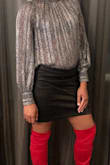 It fit like a glove with a little give so wasn't too tight. I rocked it with a blouse and thigh high boots. - Terika D.