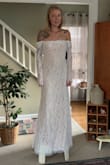 I ordered several dresses to try on for my wedding dress. This dress was STUNNING. Elegant and classy. At first I picked it as my ceremony dress and another for my reception. Though in the end, we ended up sending it back. Only downfall was that I could not comfortably raise my arms. But GOSH is it beautiful and hugs in all the right places!!! I originally ordered a small but it was too big, the XS fit PERFECTLY. - Lindsey H.