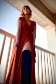 This dress brushes the floor with me but it's fine with flat shoes. The dress has a hole to pull the waist ties through which makes it very easy to adjust. The material is thick which is nice for the fall months. Very soft and stretchy. - Katie B.
