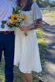 I absolutely loved this dress. Cut was expected to be low so my bralette was perfect for the occasion. Wrap dresses are very flattering. Not see through but don't wear hot pink underwear, because it's white. - Rachel B.