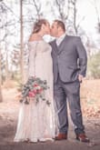 I wore this dress for my elopement. It was the perfect amount of bridal glam but still more casual than a traditional wedding dress. No issues raising my arms up but the large wasn't super tight on me (I usually wear Medium or Large depending on the item). - Colleen R.