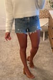 I own another pair of 501 cutoff shorts & knew I needed another pair. I was so excited when I saw these on sale! I love the consistency of Levi sizing. I always wear size 25 in Levi jeans & shorts & these fit just like my others. I'm 120 lbs with 26 inch waist & 36 inch hips. At 5'3" the 9" rise is perfect as I like them to hit at my natural waist. I also appreciate that these are long enough in the back to cover my bum. These have no stretch, so I will usually line dry to avoid shrinking. Sweater & heels in my photos are also from Lulus. Love them all! - Nicole M.
