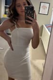 I'm in love with this dress!! I bought it for my birthday and it was the perfect fit and length! The material is a little stretchy but definitely runs true to size. - Allison C.