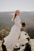 This dress was perfect for our outdoor November elopement! We pushed our big ceremony/reception to next year due to COVID-19. I didn't want to wear my actual wedding dress so I decided to grab this dress. I ordered a small and had to have the sleeves and neck taken in and the bottom hemmed because I opted for Dr. Martens instead of heels. It was absolutely perfect, I hope I can wear this again someday! - Jordan D.