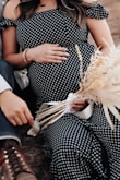 I bought this dress a while back but never had the chance to wear it, until now. It doesn't stretch, except for the off-shoulder sleeves. I wore this for my maternity shoot, though purchase was not intended for maternity. Even with a 30 week belly, it was snugged but fit just right. - Helen H.