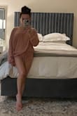 I love this so much! It's oversized but I wouldn't size down, it's meant to fit this way. The material is thin and soft and the color is a lovely blush pink. I would order this again in another color for sure. - Krystal L.