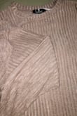 So I think this sweater is super cute. For me personally, I can see it maybe being a little less of a full length sweater and closer to a crop sweater. This doesn't bother me. Per the attached picture though, I do think the color is SLIGHTLY misleading. It is slightly more brown than I anticipated. Still, a cute sweater that I'll wear throughout the holiday szn! - Kelly C.