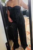 This is such a gorgeous satin jumpsuit with amazing quality. It's nice and thick, lined, definitely worth the price. However, the top area with the corset is tricky. If you have a large bust, this definitely won't work for you. The cups of the bustier are tiny. I'm a 36D/38C (170 pounds, 5'3) and ordered a XL aside from my usual large and it was not very flattering.  I'd definitely say to order a size up especially if you have a bigger chest. Also short girls beware, this is very long on me even with 3 1/2 inch heels on.  I would recommend this for taller, more flat-chested girls.  I wish it could've worked for me... it's stunning (My picture with the dirty mirror doesn't do it justice, aha!) - Olivia L.