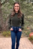 I love this sweater for the cooler weather. The back is open and its a shorter fit, but so stylish for this time of year!
Color is a beautiful dark green. - Paige B.