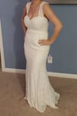 This was a really pretty dress but made me realize that tight dresses definitely don't work with my body type. The only picture I have is standing at a favorable angle but straight on, it was not a pretty picture. Otherwise the lace was really pretty and the straps were comfortable! - Rebecca R.