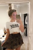 I love the shirt so much! It's the best material and I ordered it a little big so that I could do different things with that. Definitely recommend! - Olivia J.