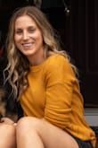 Whenever I order anything from Lulus, I always look at reviews first. I try to find someone close to my size and see what size they ordered and if they would suggest it or not. I'm usually in between sizes Small and Medium, and I ended up choosing the small. It fits perfect. The color is great and it's not too boxy. I feel like if I went with a Medium, it would've been too big. Still long enough but not too long to cover my behind. Favorite sweater I own! - Jessica P.