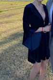 Very cute dress overall! I liked the length of the dress and feel of the fabric. It was nice and thick velvet, nothing cheap feeling about it. Obviously it's a very deep V, but I was able to wear a low bra with it. The only negative about this dress for me was the sleeves. They were a little ridiculously long in person and I hated how the inside looked. I added a photo to show what I mean... you can see this on the model as well. The inside of the sleeve is a bit lighter than the outside and is not velvet. Not enough to ruin the dress for me but it kept bugging me in pictures. - Madeline M.