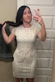 I bought this for my bridal shower. I typically wear a dress size 4 or small, but sized up to a medium so that it would kind of hang away from my body, rather than hug it (I don't like tight things). Medium was perfect for me and seems like a true fit! Love the details, color, and length. - Penny B.