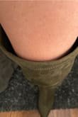 I am a faithful 7.5 in boots and I am trying these on right now and I cant figure out if they need to be smaller or not. The shoe feels really flimsy and has the feeling of a heel with some suede material loosely placed around it. The thigh holes are HUGE. They keep slipping and slouching down to my knee which gives the whole boot a really weird look. I have larger thighs and if these are huge on me I cant imagine a smaller person. For reference I am 5'4" and 155lbs. I am curvy and its all in my thighs and hips! Unfortunately, I cannot return them (I knew when buying) but that's the risk you take on Black Friday! - Amy D.