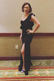 This dress fit me perfectly. I bought a black color, and I loved the unique one shoulder look and sexy leg slit. Very comfortable and flattering. - Naomi C.