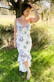 So gorgeous and I felt absolutely elegant! The neckline is extremely flattering, white is not see-through at all, and the train is just the perfect length with a couple inch heels on. I wore it to a Florida wedding and it was perfection. Absolutely loved it! - Andrea B.